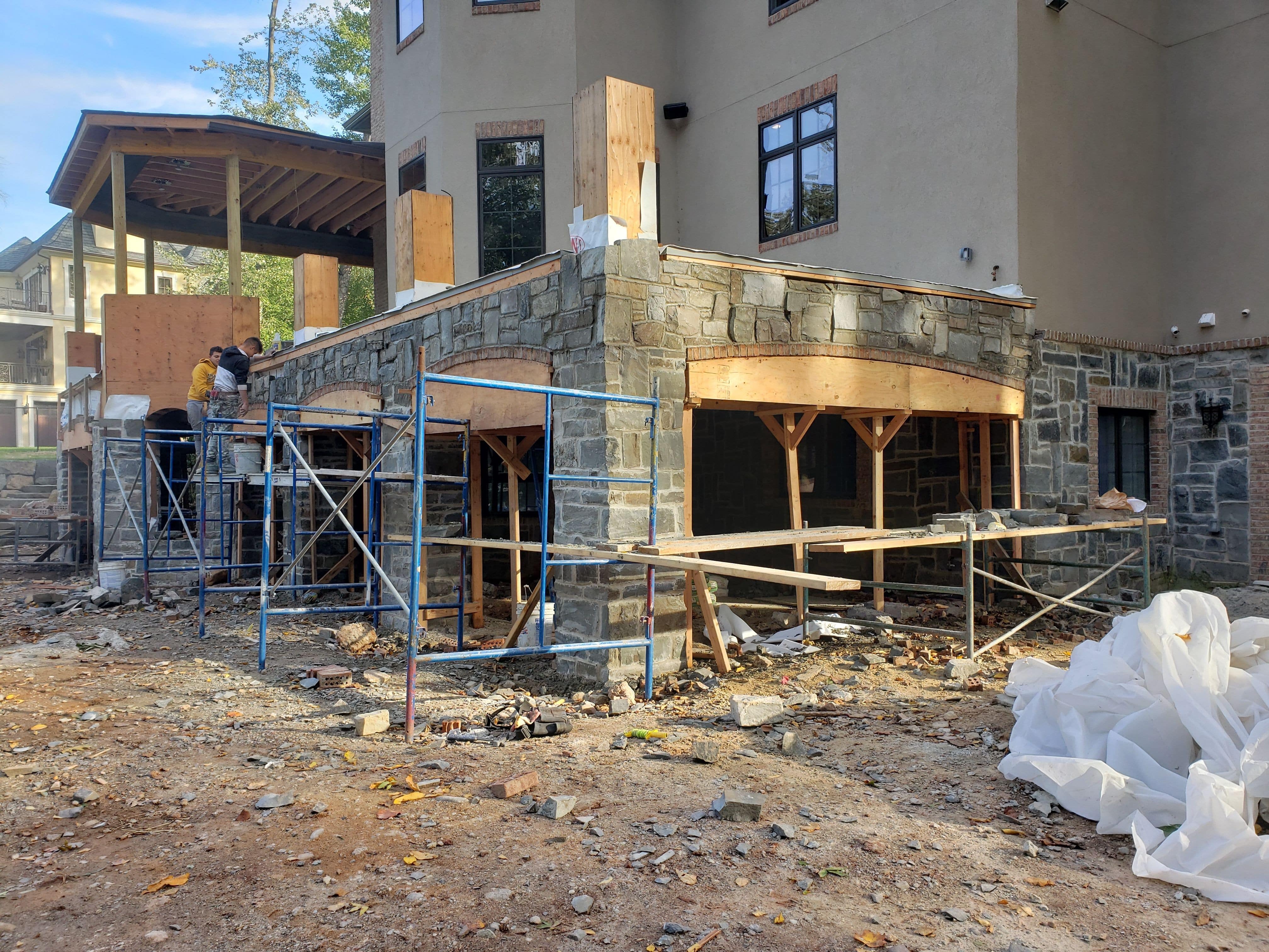 Custom arch forms to create the requested stone & brick arches between the covered entertaining space and the pool patio