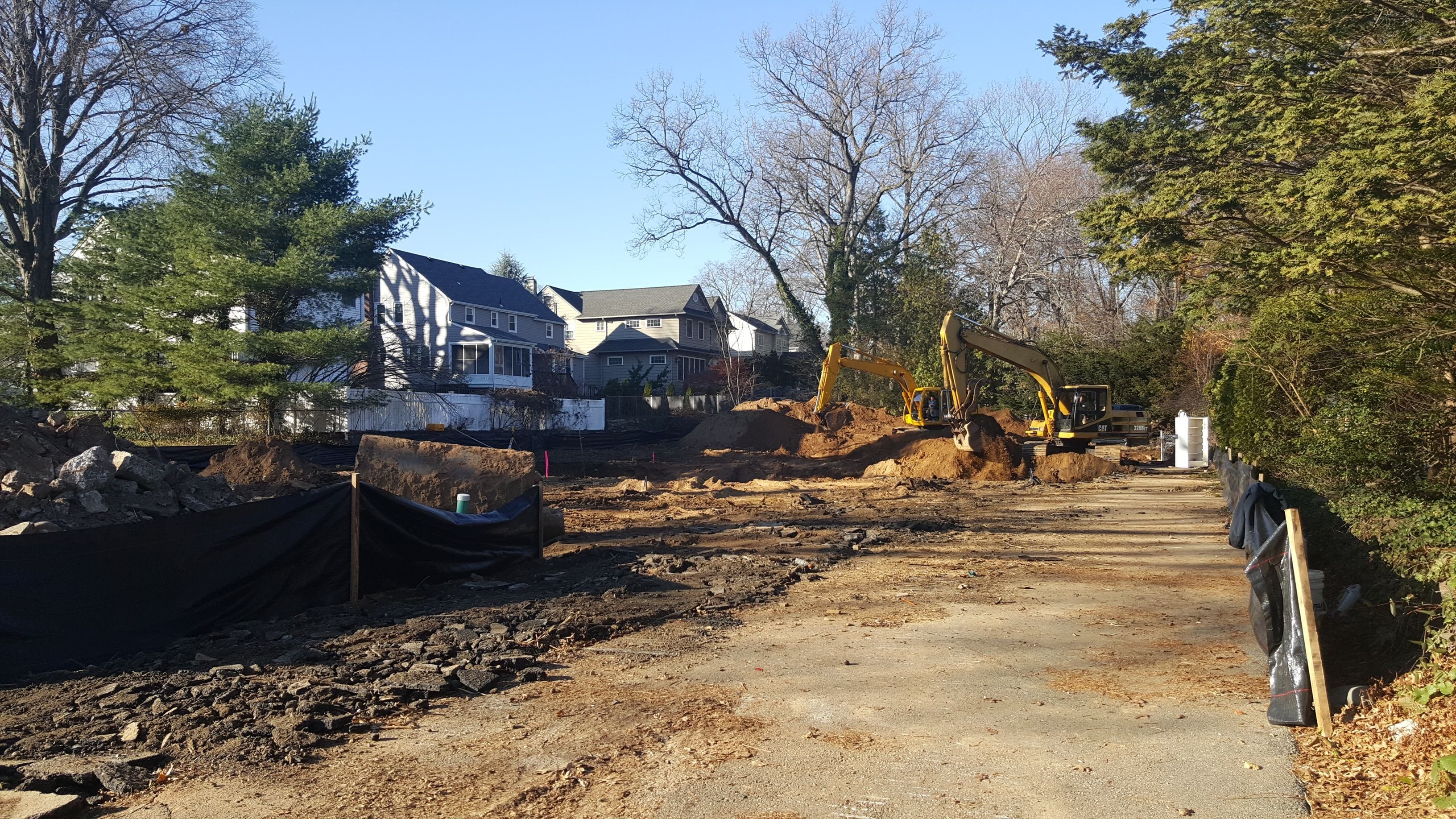 The existing home, driveway and other site conditions were removed to facilitate the start of construction