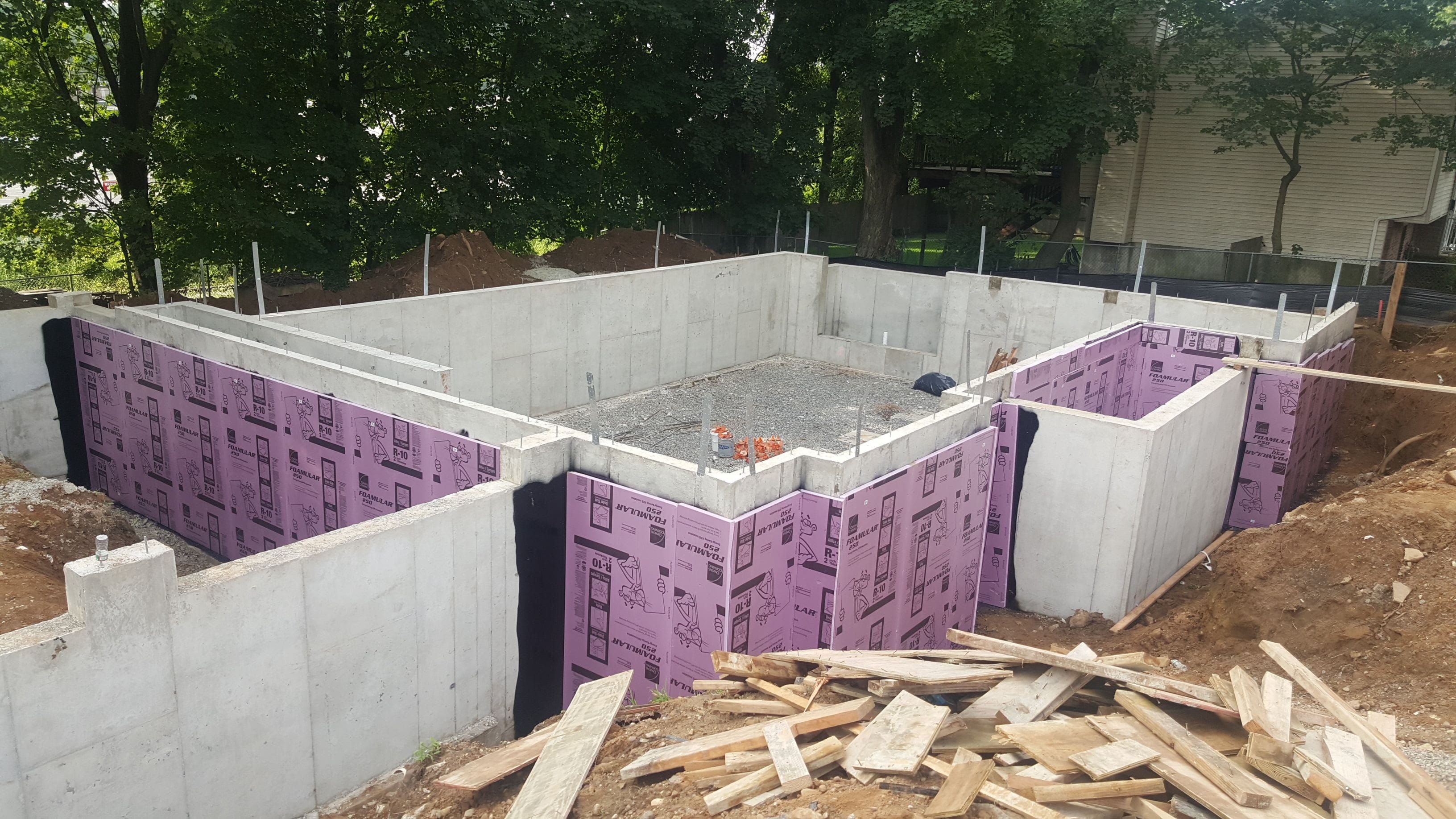 Poured foundation complete with waterproofing and insulation