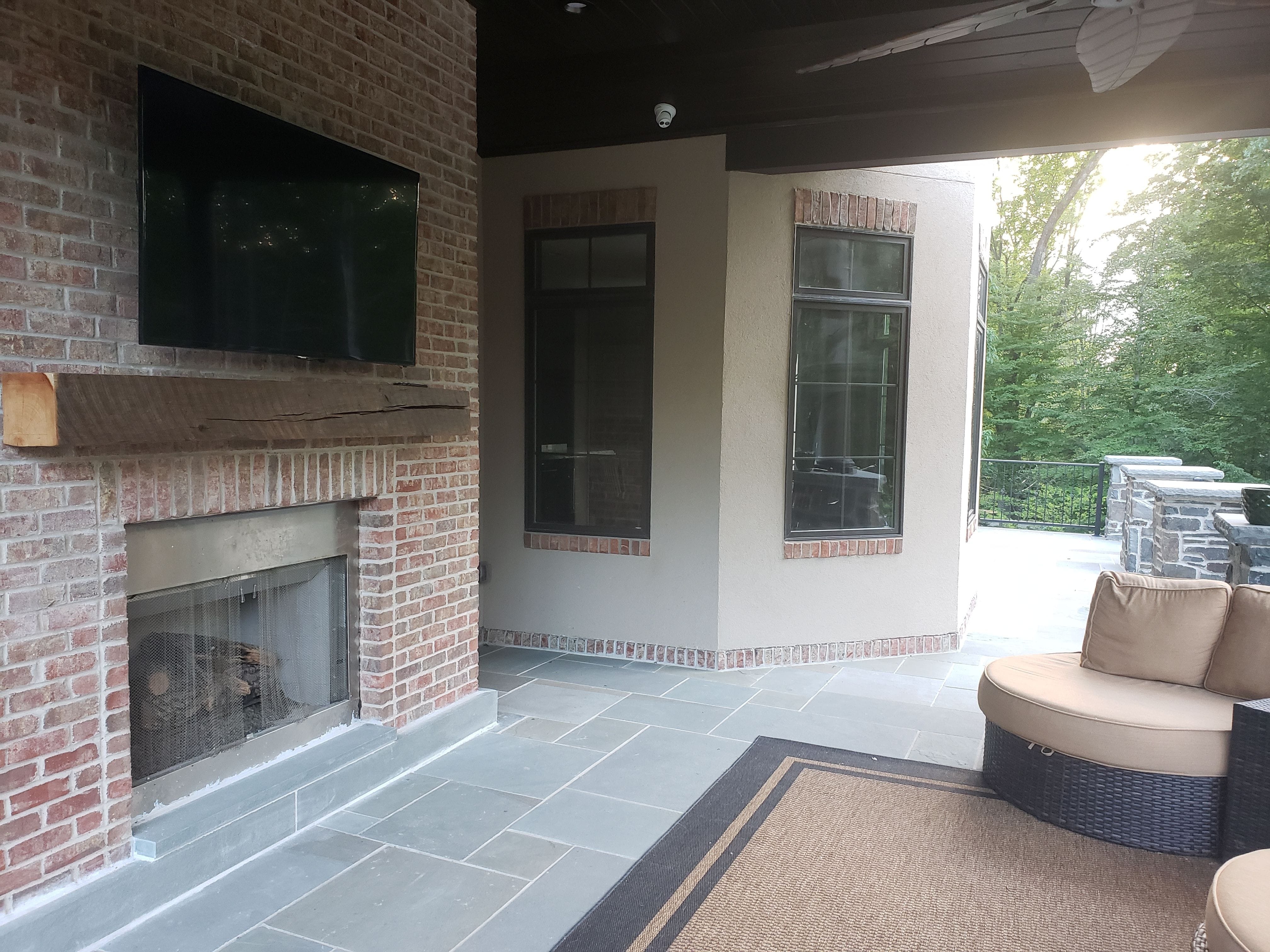 This gas fireplace and TV above make for great movie nights outside anytime of the year