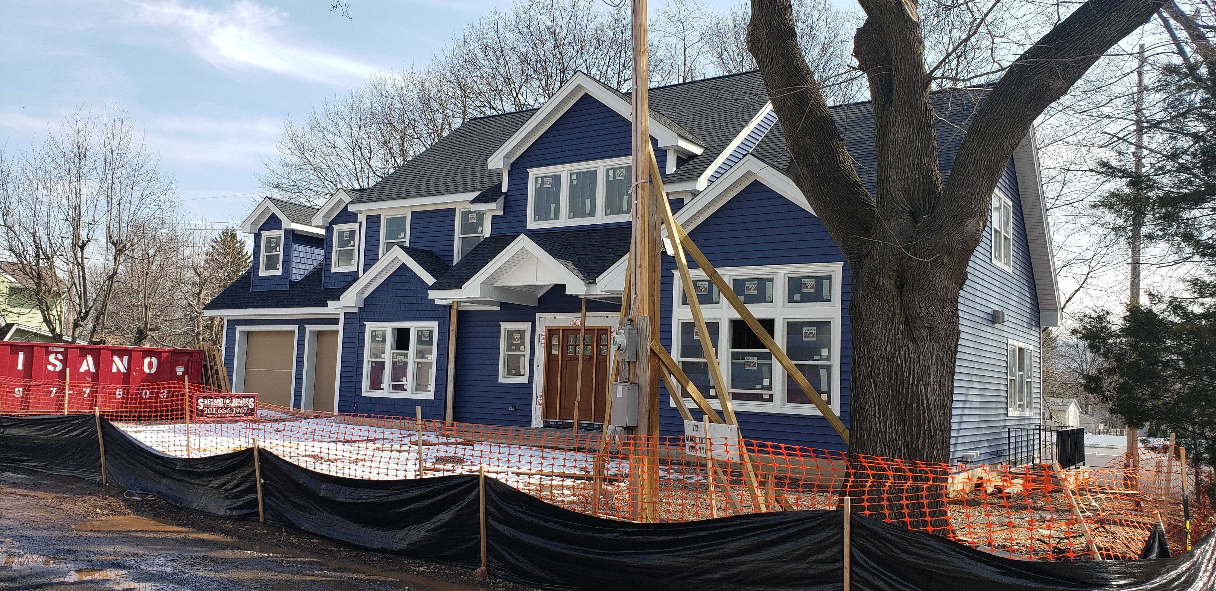 Exterior siding is installed with all pvc window surrounds