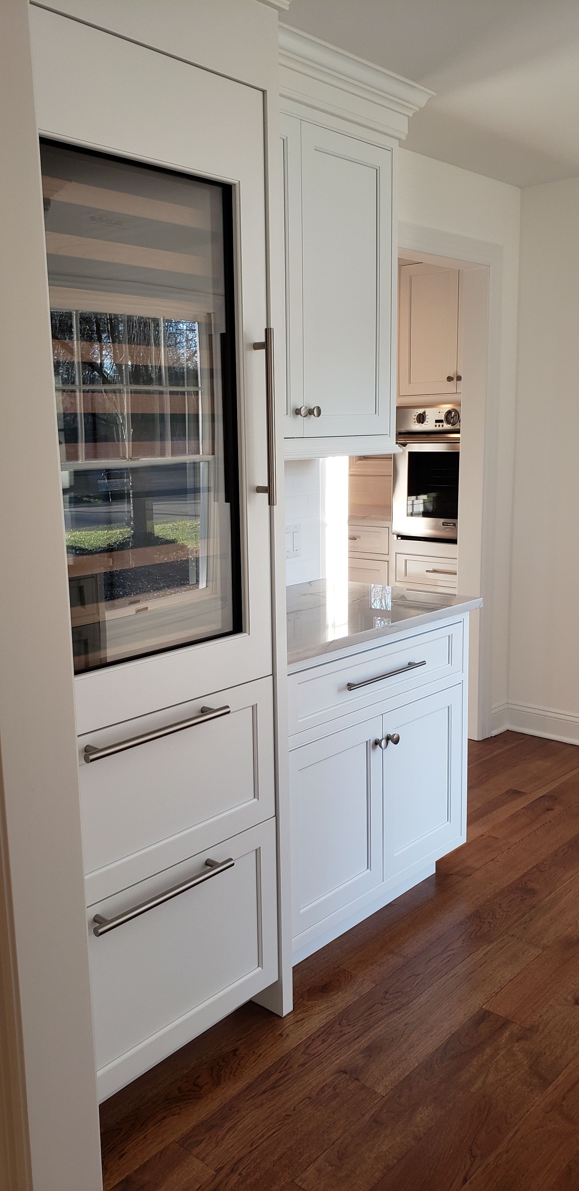 This renovation created a new butler's pantry with walk-in dry pantry as a link between the new kitchen and existing dining room